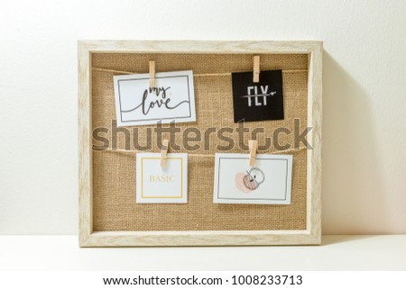 four Photo Frames and some design on Rope inside the wooden frame 