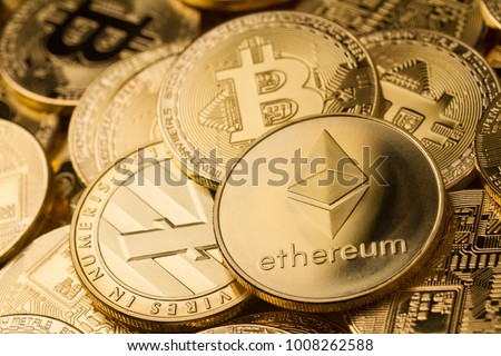 horizontal top view closeup of ethereum litecoin and bitcoin stack of golden coins background texture exchange concept Royalty-Free Stock Photo #1008262588