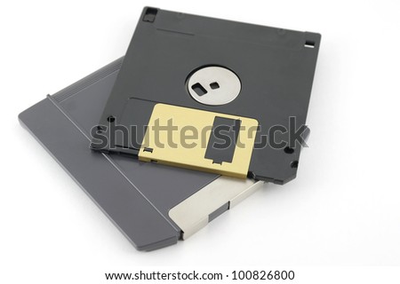 ZIP and floppy disks over white