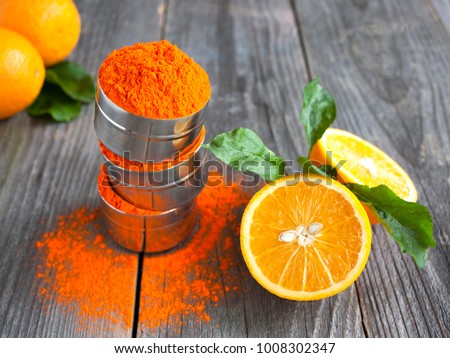 Bright orange colour for Indian holi festival. Colorful gulal (powder color) for Happy Holi with copy space. Royalty-Free Stock Photo #1008302347