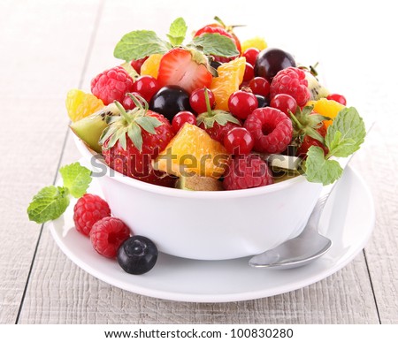 fresh fruits salad Royalty-Free Stock Photo #100830280