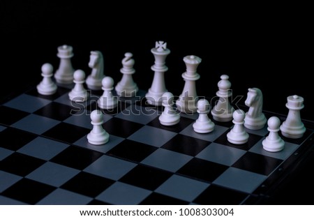 White chess figures on board. White chess set in order for game start. First move E2-E4 on checkered board. Chess figurine order. Checkmate game banner template. Intellectual sport. Tactic game