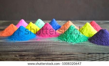 Bright colours for Indian holi festival. Colorful gulal (powder colors) for Happy Holi with copy space. Royalty-Free Stock Photo #1008320647
