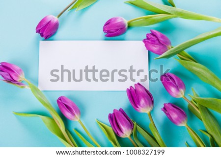 Colorful Template Greeting Card or Valentine Card for your Text with Your advertising with Spring Flowers on a Blue Background with copy space         