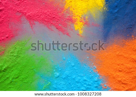 Bright colours for Indian holi festival. Colorful gulal (powder colors) splatted for Happy Holi with copy space. Royalty-Free Stock Photo #1008327208