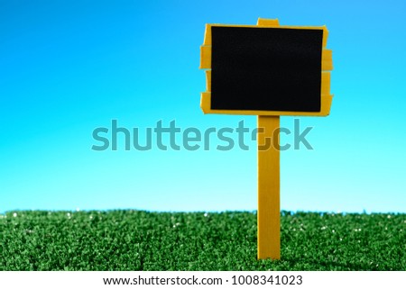 Empty blank sign placed on green grass
