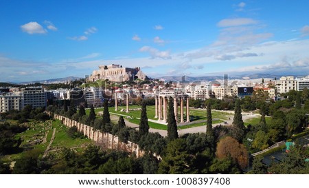 Aerial birds eye view photo taken by drone of iconic pillars of temple of Zeus and Acropolis hill at the background, Athens historic center, Attica, Greece