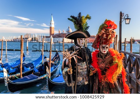 Colorful carnival masks at a traditional festival in Venice, Italy Royalty-Free Stock Photo #1008425929