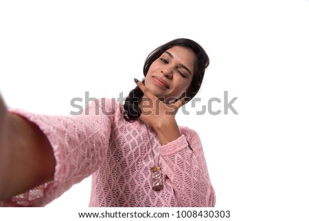 Young happy smile girl take selfie on white background