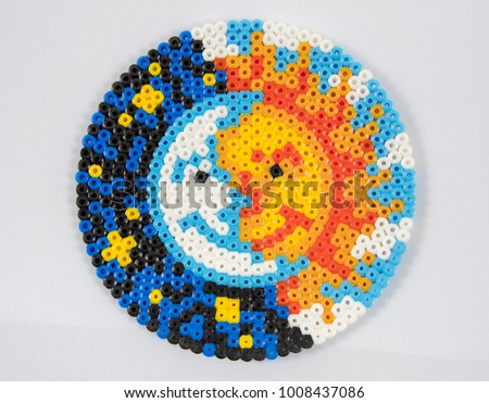 Sun and Moon concept made from small plastic beads
