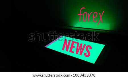 Green Florescent color of handphone screen with message against black background.
