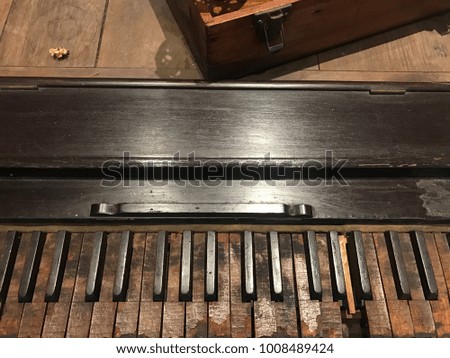 Old wooden piano that can be played.
