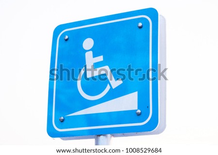 Traffic sign for the disabled people's will in the parking lot.