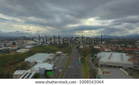 Aerial view of highway with green screen adds