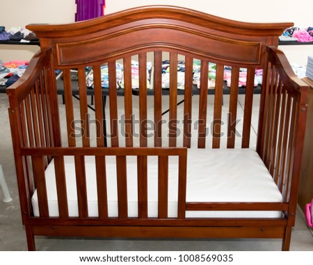 Child's crib for sale at suburban garage sale Royalty-Free Stock Photo #1008569035