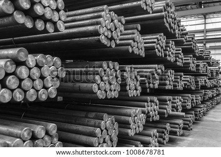 Rows of Steel Round Bar storage and stacking in the warehouse for industrial construction. Black and white with Shallow focus. Royalty-Free Stock Photo #1008678781