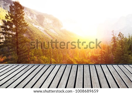 Empty wooden floor of free space and relax time with blurred background of Beautiful place. 