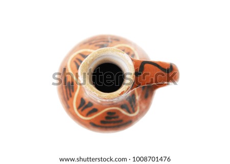 Ceramic painted, traditional jug on white background, view from above