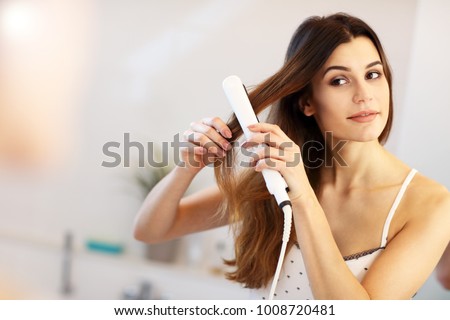 Picture showing young woman looking in bathroom mirror Royalty-Free Stock Photo #1008720481