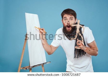 surprised painter with gestalt on a blue background, art                               