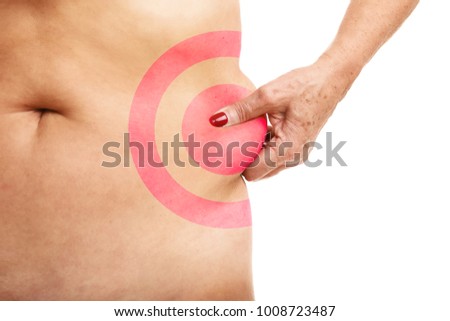 Picture of senior woman touching abdomen over white background