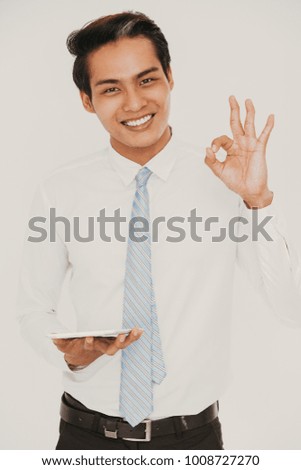 Happy manager with touchpad showing ok gesture
