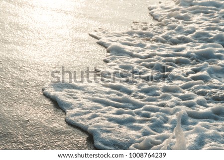 Deep blue stormy sea water surface with foam and waves pattern, natural background photo