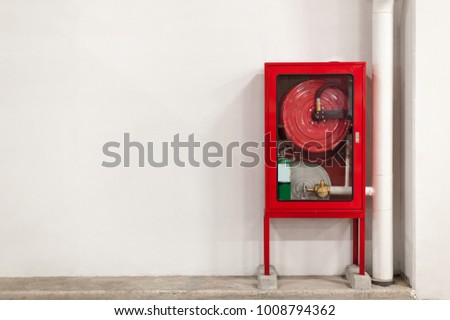 Fire extinguisher on wall in the building