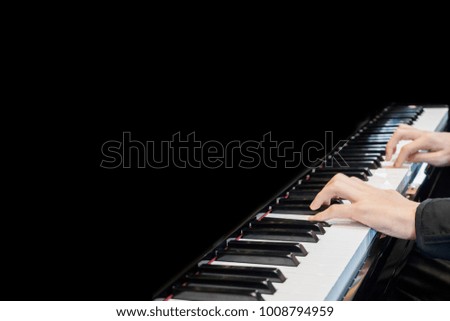 Close up musician hand playing piano