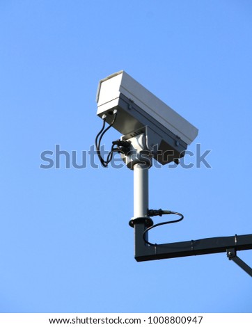 security camera overlooking an industrial area on a metal pole no people stock image stock photo