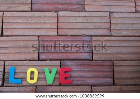Word love on brick background,happy valentine's day