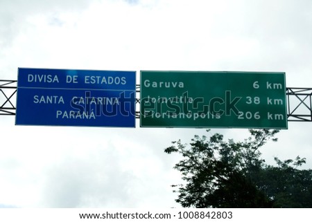 Road sign of the border of Parana and Santa Catarina State at Regis Bittencourt Highway, BR-116 that connects the cities of Sao Paulo and Rio Negro, passing through Curitiba, Brazil.