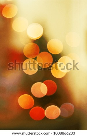 bokeh blurred bright festive colorful circles in golden yellow and red as a fantastic meditation or a mirage of the realized mindfulness
