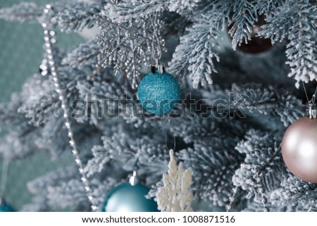 Christmas fir close-up in an interior with toys and ornaments