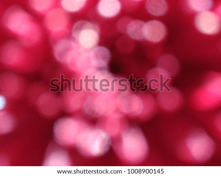 Abstract out of focus lights coming from the mother nature with abstract background of Red   flower. Abstract background of Red and White color. Good for Valentines Day celebrations. 
