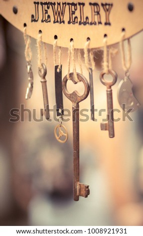 Wooden frame with metal keys. Handmade 