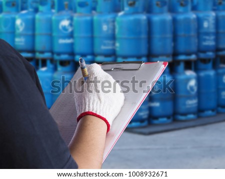  Hands workers women working In Distribution gas Warehouse Royalty-Free Stock Photo #1008932671