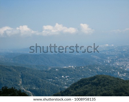 mountain landscape with blue sky and white clouds. Sochi, Russia