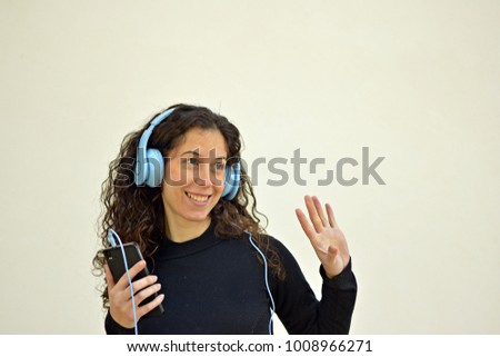 Young pretty woman with turquoise headphones