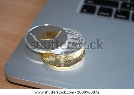 Cryptocurrency coin on the laptop. Bitcoin, ethereum, litecoin.