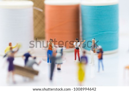 Miniature people: Group Women weaving factory protest. Image use for Claims or benefits should be earned from hard work.
