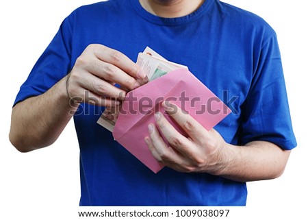 Hands open to see money in red envelope " Ang pao ", chinese new year concept .Picture have clipping path 