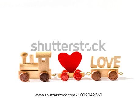 Red Heart Shape with Wooden Toy Train on isolated on white background,Image to Valentine Day concept.