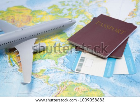 Boarding pass, passport, plane on the map.