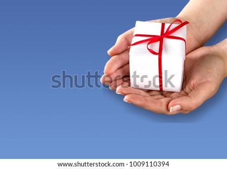 Giftbox present in woman hands