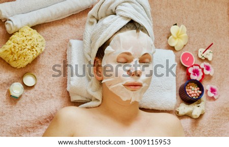 SPA. the girl is lying in a cosmetic mask. Royalty-Free Stock Photo #1009115953
