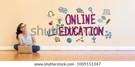Online Education text with young woman using a laptop computer on floor