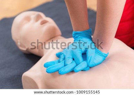 First Aid Training - Cardiopulmonary resuscitation. First aid course on cpr dummy. Royalty-Free Stock Photo #1009155145