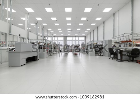 Clean production room. Manufacture of industrial electronics. Shop assembly of electronic components. Royalty-Free Stock Photo #1009162981