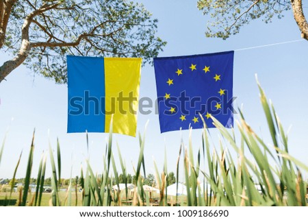 flags of the European Union and Ukraine in the open air